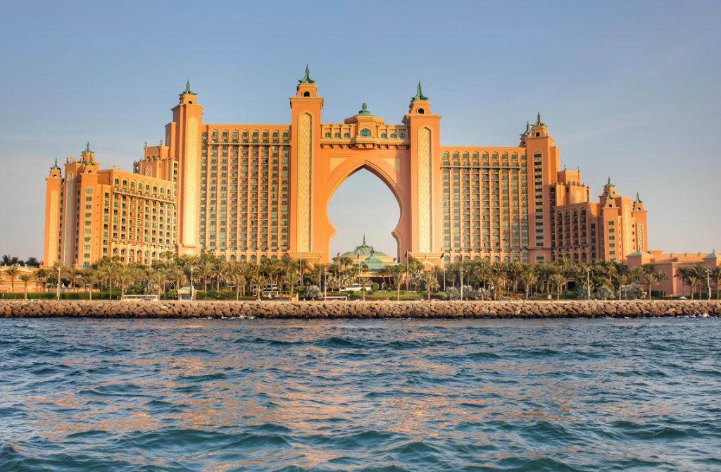 a-very-tall-building-sitting-on-top-of-a-body-of-water